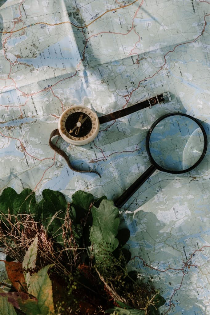 Topographical map and compass representing the journey planning layout of Beyond Living